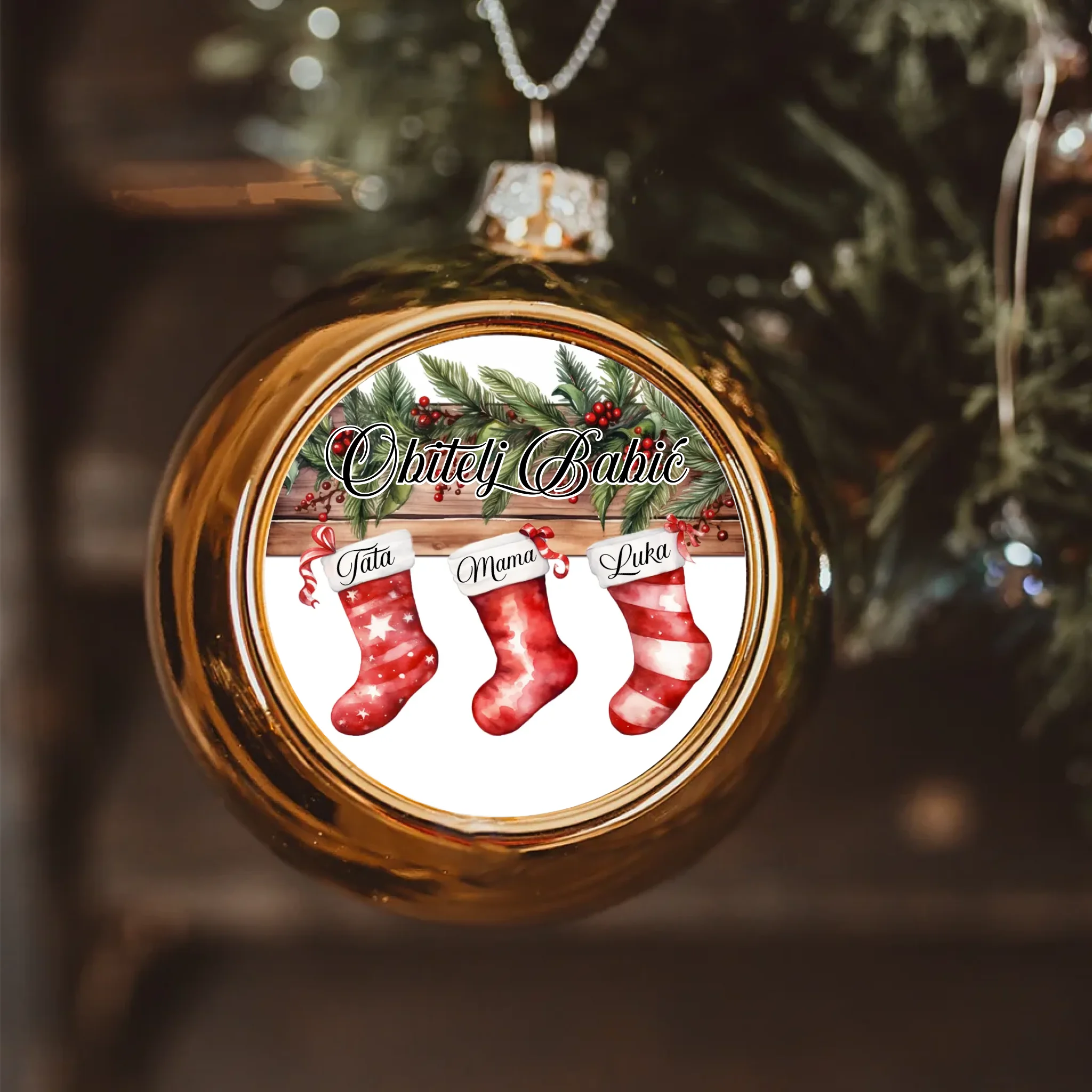 Božićni zlatni ukras s crvenim čizmicama